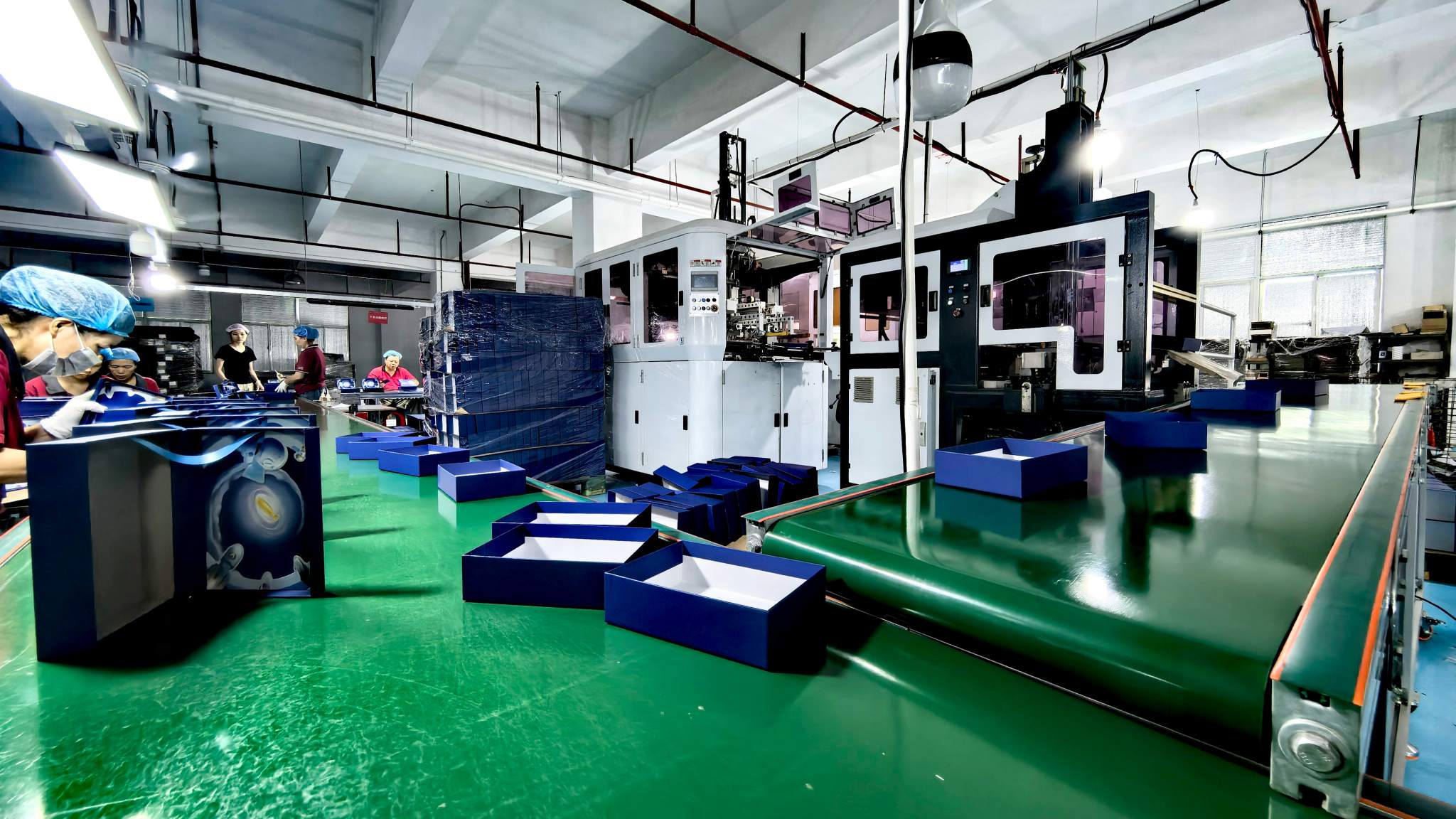 Automatic wrapping machine producing custom rigid boxes at WEIXIN GROUP