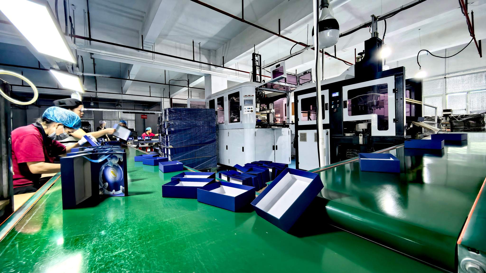 Custom rigid box manufacturing on the production floor at WEIXIN GROUP