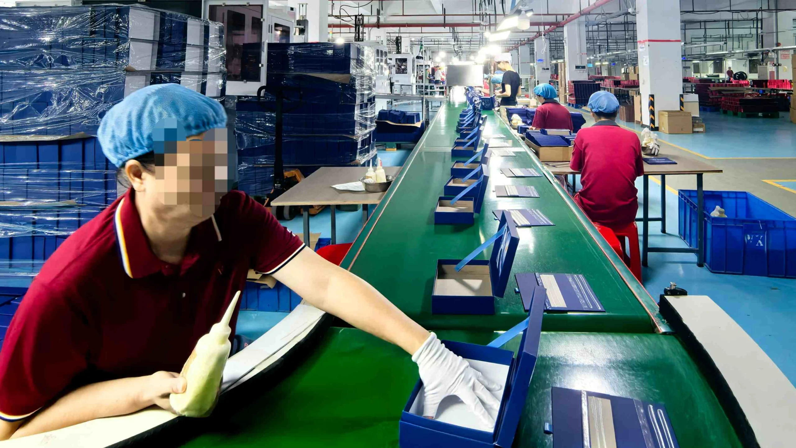 Multiple custom rigid boxes being assembled during mass production